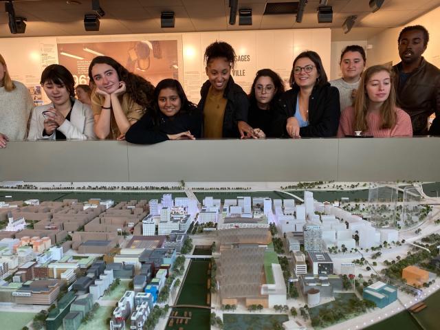 Students look at a large-scale model in France